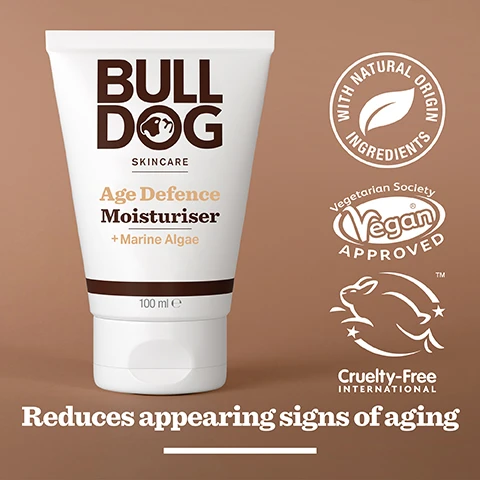 Image 2 - A tube of Bulldog Skincare Age Defence Moisturiser is displayed on a brown background, featuring visible text that reads Bulldog Skincare, Age Defence Moisturiser + Marine Algae, 100 ml, with icons indicating it contains natural origin ingredients, is Vegan approved, and Cruelty-Free international certified, along with the phrase reduces appearing signs of aging.
Image 3 - An image of green powder on a white background with text stating 96% Natural Origin, Unlock the true potential of natural origin ingredients, Marine Algae.
Image 4 - A person is holding a tube of Bulldog skincare product labeled Mature Skin, with visible text including Mature Skin and details about the products benefits and contents.
Image 5 - A tube of Bulldog Skincare Age Defence Moisturiser with a white background, featuring text that reads Bulldog Skincare Age Defence Moisturiser + Marine Algae Reduces appearance signs of ageing 100 ml Recycled Tube with additional text indicating it contains more than 27% sugarcane and over 62% PCR plastic.
Image 6 - A hand is holding a skincare product, and three Bulldog Skincare products are displayed on a white surface: an Age Defence Serum, an Age Defence Eye Roll-On, and an Age Defence Moisturiser, with visible text that reads Reduce the appearance of fine lines and wrinkles.
