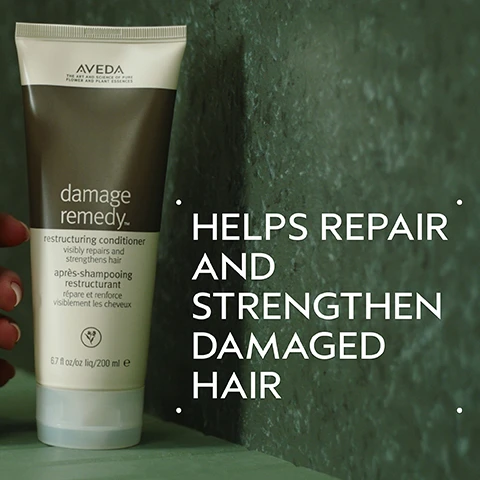 Image 2 - A persons hand holds an Aveda Damage Remedy conditioner tube, which displays the text AVEDA THE ART AND SCIENCE OF PURE FLOWER AND PLANT ESSENCES damage remedy™ restructuring conditioner visibly repairs and strengthens hair après-shampooing restructurant répare et renforce visiblement les cheveux 6.7 fl oz/oz liq/200 ml e, while large white text to the right reads HELPS REPAIR AND STRENGTHEN DAMAGED HAIR. Image 3 - A quinoa plant with reddish stems and seed heads is shown in a white circular frame on a dark green background, with the text QUINOA PROTEIN HELP REPAIR AND STRENGTHEN HAIR. Image 4 - A before and after comparison image shows a woman with long, reddish-blonde hair; the left panel depicts her hair looking less defined, and the right panel shows her hair more voluminous and wavy after styling. BEFORE, AFTER, Unwashed Hair, Results with Damage Remedy™ Restructuring Shampoo and Conditioner, Daily Hair Repair, Volumizing Tonic and Light Elements™ Defining Whip. Blow dried with diffuser attachment. Image 5 - A smooth, thick dollop of white cream with subtle swirls and a soft shadow rests on a clean white background. Image 6 - A hair care routine infographic displays four steps with accompanying circular images on a dark green background. The visible text reads: HOW TO USE 01 CLEANSE Damage Remedy™ Restructuring Shampoo 02 CONDITION Damage Remedy™ Conditioner 03 TREAT Damage Remedy™ Daily Hair Repair 04 STYLE Volumizing Tonic and Light Elements™ Defining Whip. Image 7 - A background of dark green leaves with three white logos: a vegan logo showing a V surrounded by 100% VEGAN, a Certified B Corporation logo showing Certified, a B in a circle, and Corporation, and the Leaping Bunny Cruelty Free International logo with a rabbit and the text Cruelty Free INTERNATIONAL.