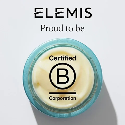A glass jar of cream with a blue lid displaying a certification logo, above which is the text ELEMIS and Proud to be.