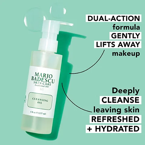 A bottle of Mario Badescu Cleansing Oil is displayed against a light green background, with text highlighting that it has a dual-action formula that gently lifts away makeup and deeply cleanses, leaving skin refreshed and hydrated.