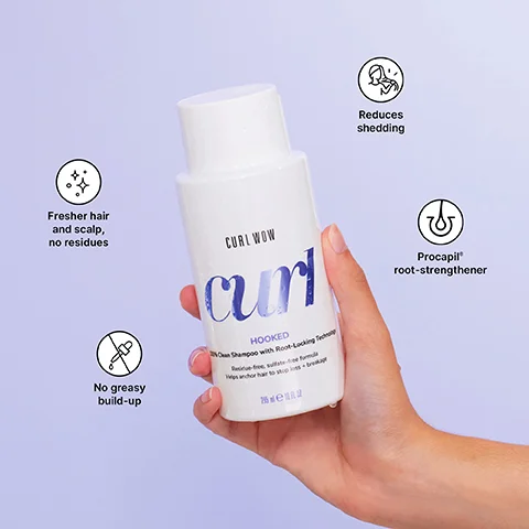 A hand holds a white shampoo bottle that says CURL WOW curl HOOKED 100% Clean Shampoo with Root-Locking Technology Residue-free, sulfate-free formula Helps anchor hair to stop loss + breakage 295 ml e 10 fl oz, surrounded by icons stating Fresher hair and scalp, no residues, No greasy build-up, Reduces shedding, and Procapil root-strengthener.