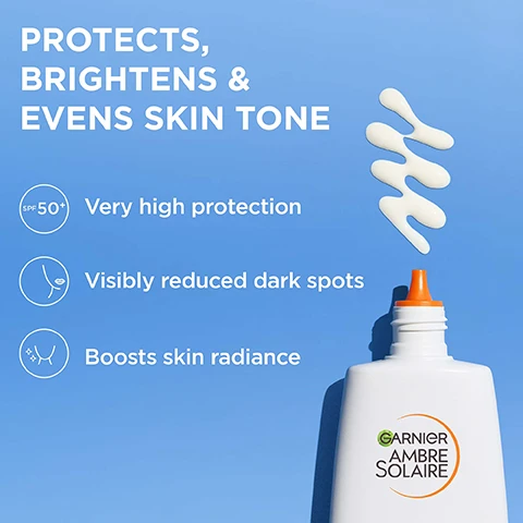 Image 1 - White sunscreen liquid drips above a bottle on a blue background with text PROTECTS, BRIGHTENS & EVENS SKIN TONE, SPF 50+ Very high protection, Visibly reduced dark spots, Boosts skin radiance, GARNIER AMBRE SOLAIRE. Image 2 - A swirling yellow liquid with small spheres against a white background with the text KEY INGREDIENTS, VITAMIN C, GLYCERIN, VITAMIN E. Image 3 - Close-up of a finger applying white lotion to a persons cheek with the text HOW TO USE STEP 1 Apply generously on skin STEP 2 Reapply throughout the day. Image 4 - A white bottle dispenses white lotion onto a blue background next to text that reads BRIGHTENING & LIGHTWEIGHT FORMULA, Non-greasy, No white marks, Invisible finish. Image 5 - White liquid pours from a bottle with an orange tip next to text that says DERMATOLOGICALLY TESTED Non-comedogenic Ophthalmologically tested.