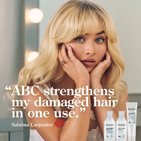 Image 1 - A woman with long blonde hair and blue eyes is resting her hands on her face with a surprised expression, beside three Redken hair products; visible text reads ABC strengthens my damaged hair in one use, Sabrina Carpenter.
Image 2 - A bottle of Redken Acidic Bonding Concentrate shampoo surrounded by suds on a gradient background, with visible text stating 56% LESS BREAKAGE*, SILKY FINISH & GLOSSY SHINE, and 11X SMOOTHER**.
Image 3 - A close-up of a white shampoo bottle with an open lid showing a small amount of cream inside, accompanied by text stating 56% less breakage*, 90% more conditioned*, and 11X smoother**.
Image 4 - Image shows swirls of white and translucent gel-like substances with the text CITRIC ACID + BONDING CARE COMPLEX HELPS REPAIR BONDS + PREVENT FUTURE DAMAGE.
Image 5 - Image shows a side-by-side comparison of hair, with the left side labeled BEFORE displaying dry, frizzy, and uneven strands, and the right side labeled AFTER ONE USE* showing smooth, straight hair; visible text includes *SYSTEM OF ACIDIC BONDING CONCENTRATE INTENSIVE TREATMENT; SHAMPOO, CONDITIONER, & LEAVE-IN VS. UNDAMAGED HAIR.
Image 6 - Image shows a comparison of curly hair before and after treatment; the left side labeled BEFORE shows frizzy, dry curls, while the right side labeled AFTER ONE USE* displays smoother, healthier-looking curls; additional text states *SYSTEM OF ACIDIC BONDING CONCENTRATE INTENSIVE TREATMENT, SHAMPOO, CONDITIONER, & LEAVE-IN VS. UNDAMAGED HAIR.
Image 7 - Two bottles of Redken Acidic Bonding Concentrate shampoo and conditioner are displayed on a pastel gradient background, with five stars above and the text BEST I’VE EVER USED AND I’M A HAIRDRESSER followed by a note that reads RECEIVED THE PRODUCT TO TRY FROM MARIE CLAIRE BEAUTY DRAWER, AUG 2022.
Image 8 - Image shows a trio of Redken hair care products on a gradient background, labeled with numbers: 1 for shampoo, 2 for conditioner, and 3 for protect and leave-in treatment, with visible text stating DAMAGE REPAIR FOR CHEMICALLY TREATED HAIR and details about each products features and concentrations.
Image 9 - A close-up image of a black comb resting on brown hair, with text that reads REINFORCE WEAK BONDS, SAM VILLA 30012, along with illustrations of a damaged bond and a repaired bond, and a note about continued use of acidic bonding concentrate intensive pre-treatment.
Image 10 - Image shows three bottles of Redken hair products against a pink background, with bold text stating BEST I’VE EVER USED AND I’M A HAIRDRESSER, along with product details for acidic bonding concentrate, shampoo, and conditioner, including citric acid percentages.