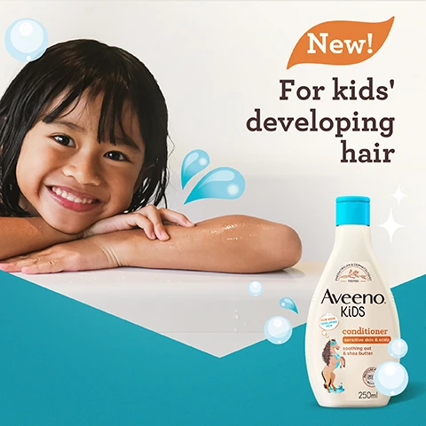 Image 1 - A smiling child with wet hair rests on a white surface while a bottle of Aveeno Kids conditioner is displayed next to her, with text reading New! For kids developing hair.
Image 2 - Image of dried oat flowers arranged in a hexagonal dish next to a small bowl of shea butter, with the text With soothing oat & shea butter displayed above.
Image 3 - Image of two bottles of Aveeno Kids shampoo and conditioner on a bathroom countertop, with a wooden hairbrush and a playful orange mask in the background, featuring the text that reads: Use with AVEENO® KiDS Shampoo for triple benefits: softens, nourishes & helps manageability.
Image 4 - A cartoon horse wearing a mask and cape is next to a bottle of Aveeno Kids conditioner, which is labeled as hydrating, nourishing, and easy to manage, with accompanying text that reads for kids sensitive skin & scalp soothing oat & shea butter.
Image 5 - A bottle of Aveeno Kids conditioner is shown, featuring a horse wearing a blue mask and a girl with curly hair, with visible text stating 50% recycled plastic bottle and recyclable bottle.
Image 6 - A bottle of Aveeno Kids conditioner is shown against a teal background, with text highlighting features: tear-free, free from dyes, and gentle fragrance; the bottle is 250 ml and shows a child with wavy hair.