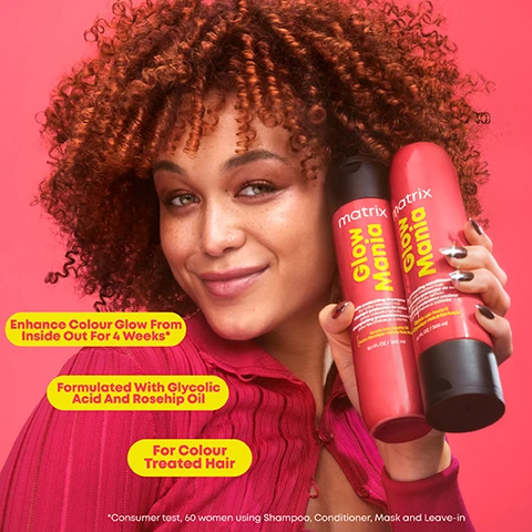 Image 2 - A smiling person with curly hair holds two hair care products against a pink background, features text that reads Enhance Colour Glow From Inside Out For 4 Weeks, Formulated With Glycolic Acid And Rosehip Oil, and For Colour Treated Hair.
Image 3 - A clear bottle of Matrix Glow Mania color protecting shampoo is shown against a bright pink background, surrounded by sparkling bubbles, with visible text stating Helps Preserve Your Colour Glow, Hair Feels Softer and Looks Shinier, and Vegan Formula*.
Image 4 - Image showing the back of a persons head with curly hair, presented in two sections labeled Before on the left and After on the right, against a pink background, with a note at the bottom: *When Used With A system Of Shampoo, Mask And Leave-in.
Image 5 - A halved coconut with a shiny white interior is surrounded by slices of grapefruit and mango, along with fresh geranium flowers, on a bright pink background, featuring the text Sweet Coconut Water, Juicy Mango, Fresh Geranium, and Sparkling Grapefruit.
Image 6 - A vibrant arrangement of hair care products on a red background includes two bottles labeled matrix Glow Mania for shampoo and conditioner, a jar labeled matrix Glow Mania Glazing Mask, and a spray bottle labeled matrix Glow Mania Leave-In Conditioner, alongside text indicating steps 1, 2, and 3 for hair care.