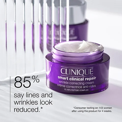 Image 1 - A close-up image of a purple jar of Clinique Smart Clinical Repair wrinkle correcting cream with visible text stating 85% say lines and wrinkles look reduced and *Consumer testing on 143 women after using the product for 4 weeks.