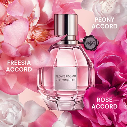 A pink faceted perfume bottle named Flowerbomb Viktor&Rolf is surrounded by pink and white flower petals, with text labels indicating Freesia Accord, Peony Accord, and Rose Accord.