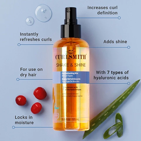 Image 1 - The image displays an iridescent orange bottle of Curlsmith Shake & Shine Curl Refreshing Mist with a black spray top, set against a light blue background with water droplets, three red berries, an aloe vera leaf and a small slice; visible text includes Instantly refreshes curls, For use on dry hair, Locks in moisture, Increases curl definition, Adds shine, With 7 types of hyaluronic acids, CURLSMITH, SHAKE & SHINE, Curl Refreshing Mist, All Curl Types, Brume Rafraîchissante, Tout Type De Boucles, 7 hyaluronic acids, acides hyaluroniques, with seawood extract, avec extrait dalgue marine, vegan, and 6.6 fl oz 195 mL. Image 2 - A smiling woman with blonde, curly hair holds a Curlsmith Shake & Shine product, against a blue background, with text that reads Reduces frizz by up to 41% and CURLSMITH SHAKE & SHINE. Image 3 - A hand sprays an orange bottle of Curlsmith Shake & Shine curl refreshing mist against a blue background, with visible text on the image reading Delivers long-lasting frizz control up to 24 HRS* and on the bottle CURLSMITH SHAKE & SHINE Curl Refreshing Mist All Curl Types Brume Rafraîchissante Tous Types De Boucles nourished with apricot extract & vegan marine algae 6.8 fl oz / 205 mL. Image 4 - An orange Curlsmith Shake & Shine Curl Refreshing Mist bottle stands on a blue surface with water droplets, against a rippling water background, with visible text Up to 41% increase in hydration*, All Curl Types, Brume Rafraîchissante Tout Type De Boucles, 7 hyaluronic acids, acides hyaluroniques, with seaweed extract, and avec extrait dalgue marine. Image 5 - An image displays two bottles of Curlsmith Shake & Shine curl refreshing mist on a split orange and blue background, showing old and new packaging, with a blue arrow icon between them and a blue circular badge at the top right stating Same Great New Look Product; the bottle on the left has old packaging and reads Curlsmith Moisture Recipe / Recette Hydratante Shake + Shine Curl Refreshing Mist / Brume Rafraichissante Pour Cheveux Boucles 7 Hyaluronic Acids / Acides Hyaluroniques + Seaweed / Algue Marine All Curl Types / Tous Type De Boucles 6.6 fl oz / 195 mL, while the bottle on the right has new packaging and reads Curlsmith Shake & Shine Curl Refreshing Mist / All Curl Types / Brume Rafraîchissante / Tout Type De Boucles 7 hyaluronic acids / acides hyaluroniques with seaweed extract / avec extrait dalgue marine 6.6 fl oz / 195 mL.